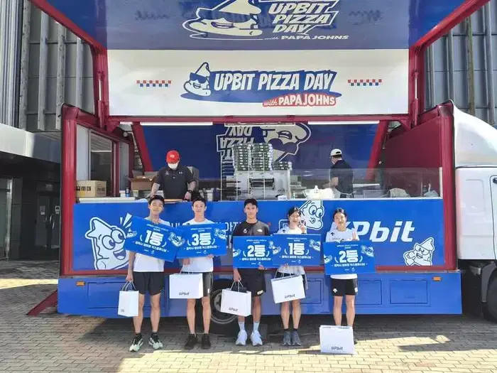 Upbit, Why Did It Send a Pizza Truck to the National Training Center?